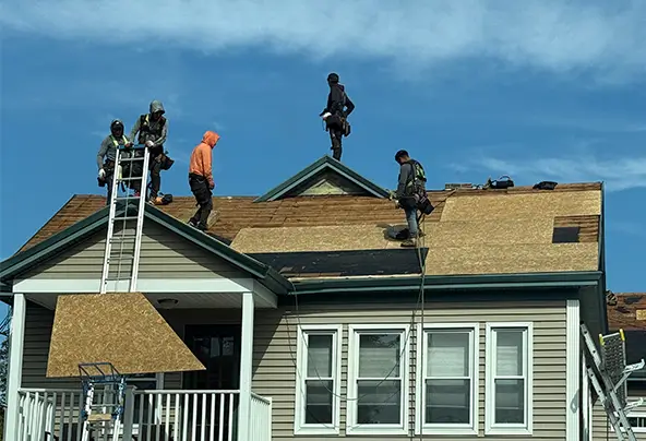 Roof replacement team on the roof