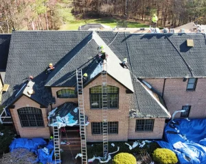 A roof replacement in progress in reference to the question "How long does it take to replace a roof?"